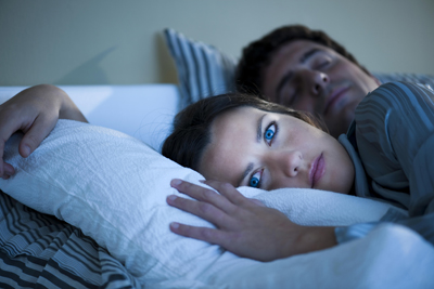 woman in bed with insomnia