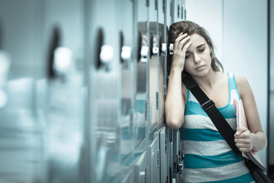 woman with anxiety at the school locker area