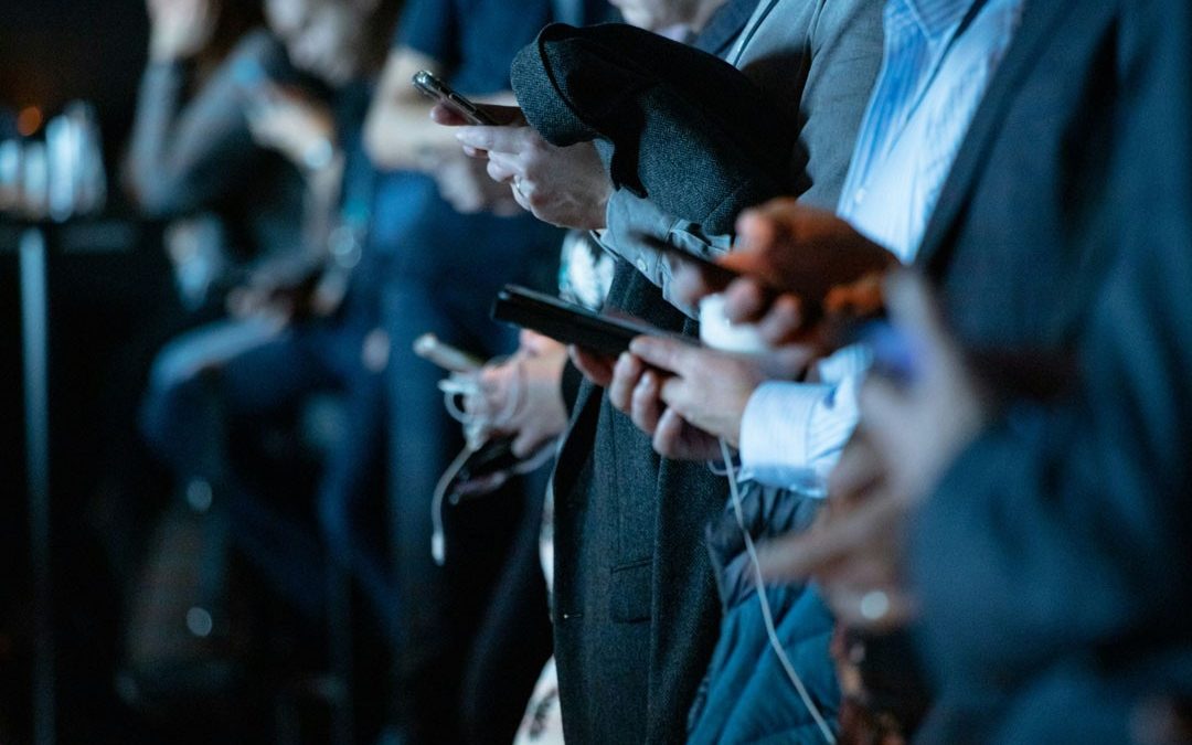 people-checking-phone-status-camilo-jimenez-unsplash