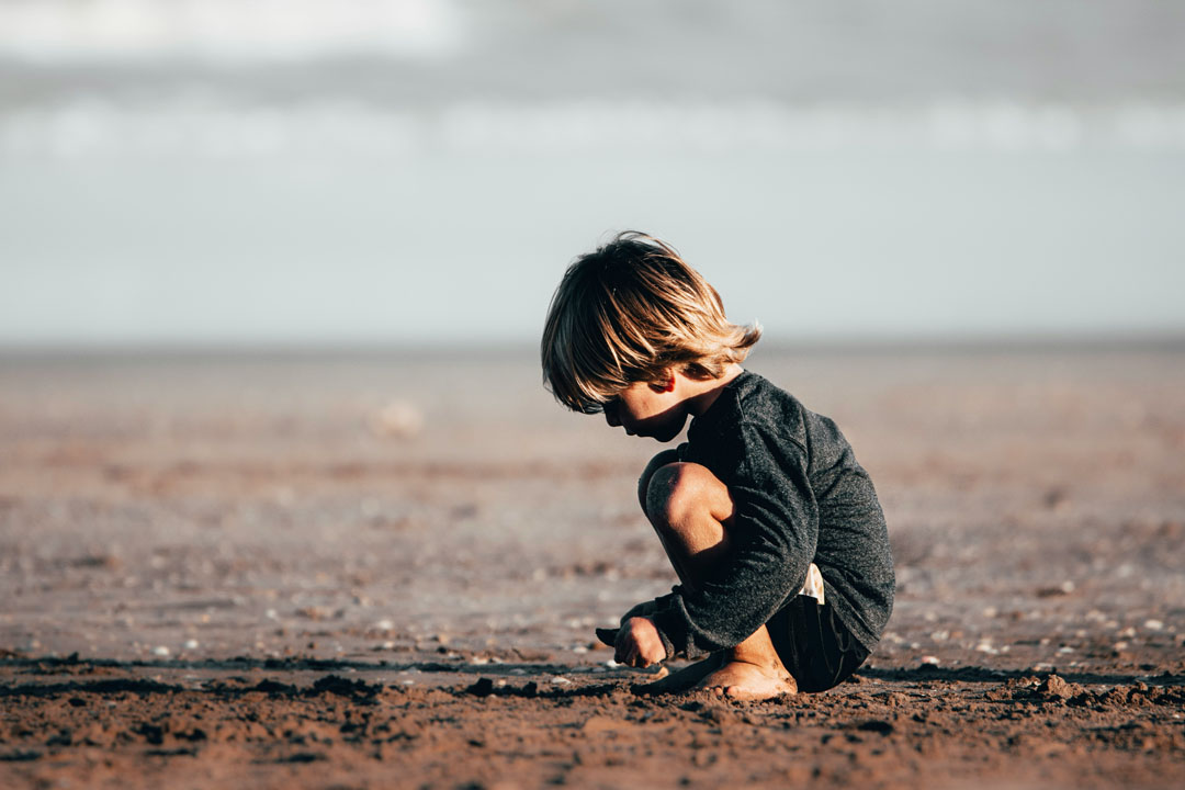 little-child-playing-on-the-sand-during-daytime-by-fermin-rodriguez-penelas-at-unsplash