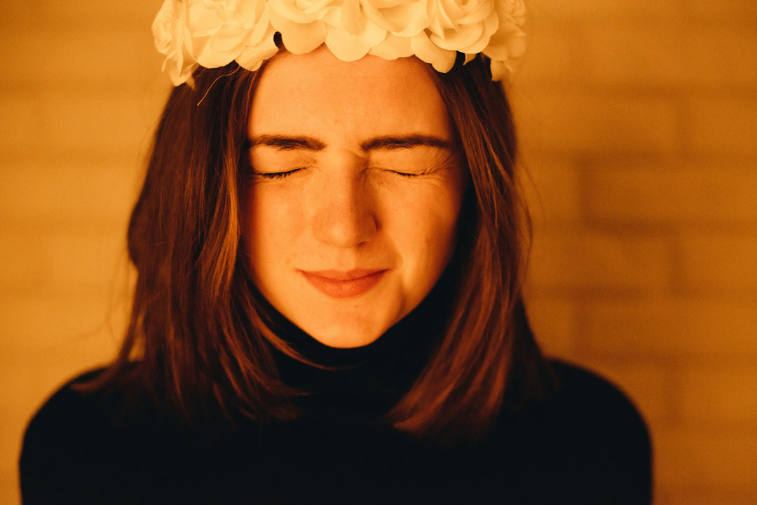woman-both-closed-eyes-with-white-flower-headress-by-dmitriy-frantsev-at-unsplash